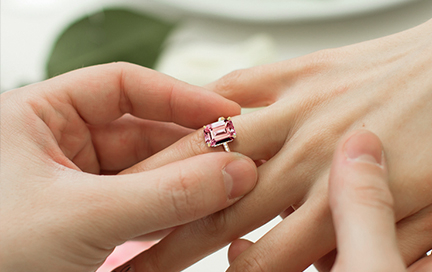 A man proposing with a morganite engagement ring.