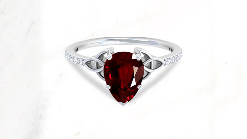 Pear-shaped ruby ring in Celtic style
