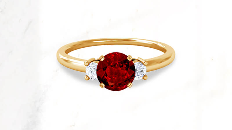 Round shaped ruby engagement ring in gold
