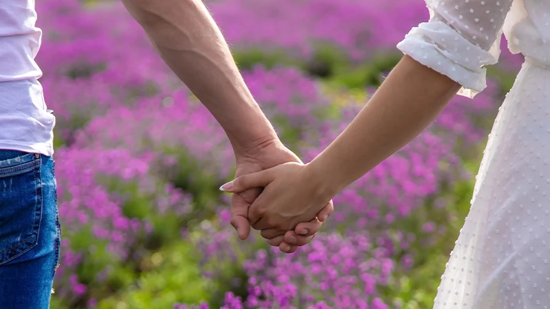 man and a woman holding hands