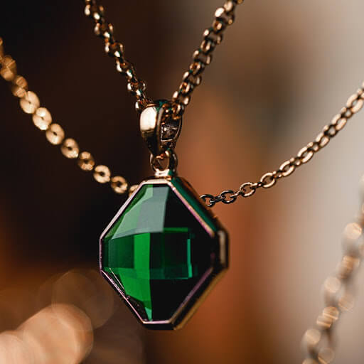a green deep green emerald pendant