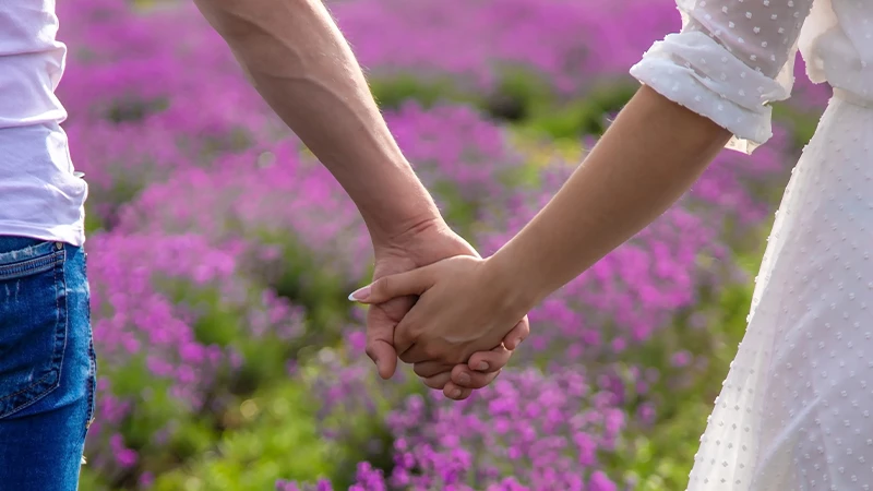 Couple holding hands