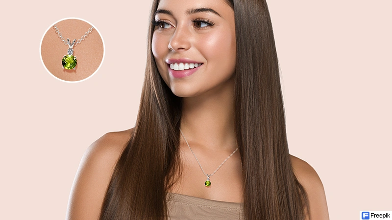 happy person wearing peridot jewelry such as pendant or rings