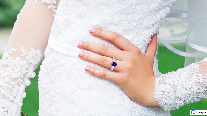 bride wearing a tanzanite ring