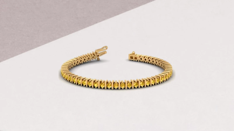 yellow sapphire tennis bracelet in yellow gold setting