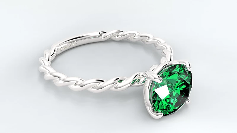 round emerald ring in platinum