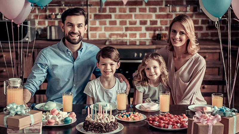 celebration image of a child’s birthday with parents