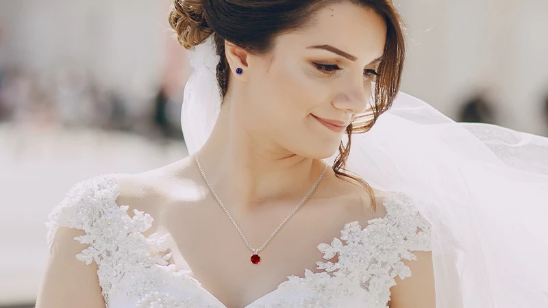 woman wearing a colorful gemstone necklace