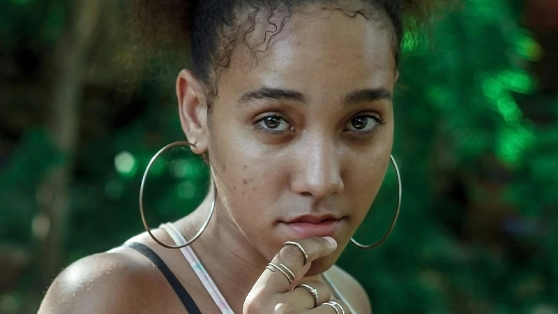 woman wearing oversized metal hoop earrings