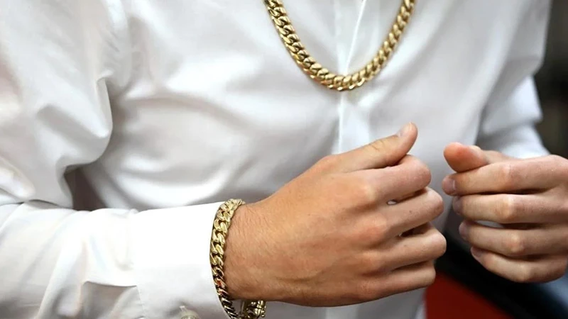 man wearing link chains and a link bracelet