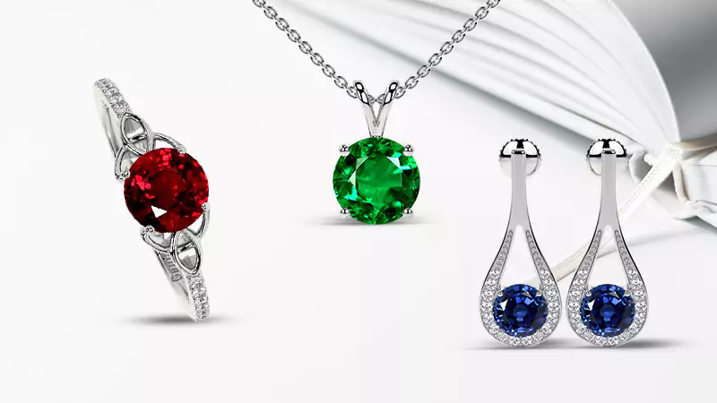 ruby ring, emerald pendant and sapphire dangle earrings