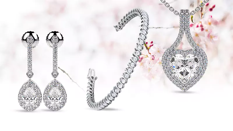 diamond pendant, earrings, and bracelet