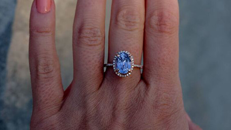 Blue Sapphire and Diamond Halo Engagement Ring