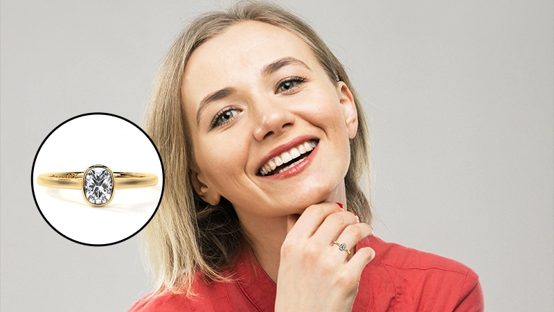 cushion cut bezel set diamond ring in yellow gold