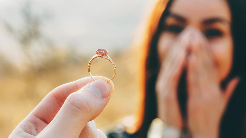 lady adoring her rose quartz ring