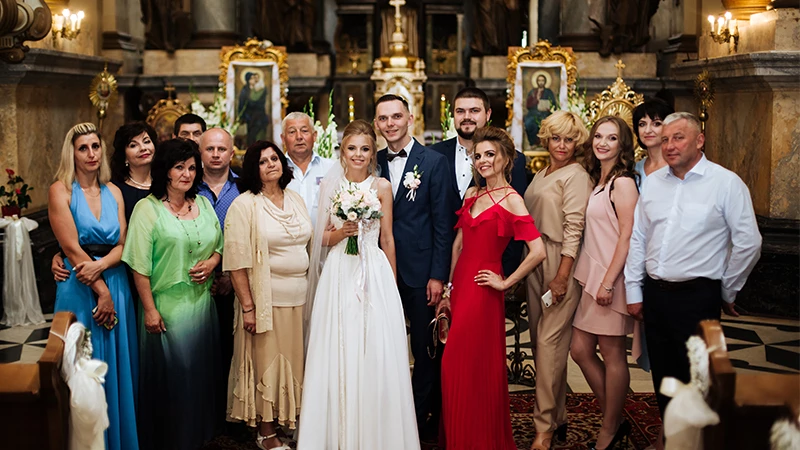 bride and groom with their family and friends