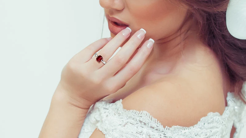 bride showing her wedding rings