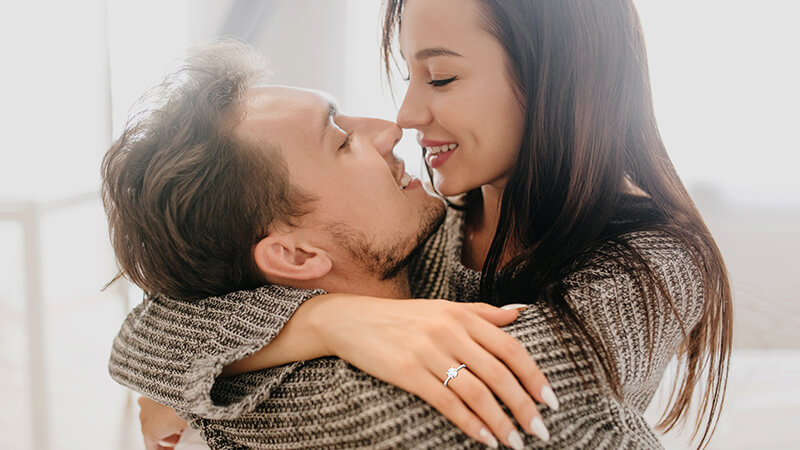 woman wearing diamond ring after proposal