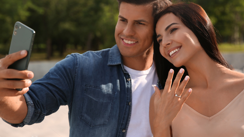 couple taking selfie after getting engaged